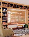 Library Love Seat Area with custom cushion and Plantation Shutters in Light Colored Stained Wood-- Royal Palm Beach Florida