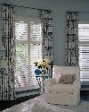 Drapery on wrought iron poles with white composite Plantation Window Shutters -- Palm Beach Gardens Florida