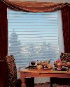 Silhouette Window shades/blinds 4 inch vane size with poor boy top treatment of panels Delray Beach Residence