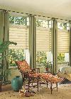 Vignette Window Shades/Blinds and angled stationary drapery panels -- puddled shown in Jupiter Florida Florida room