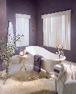 Window Treatments Vertical blinds/Verticals for Sliding Glass Doors in this attractive purple bathroom add the finishing touch to this Jupiter Florida residence
