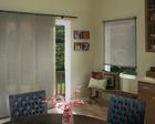 Hunter Douglas Skyline Gliding  Window Panels Blinds For Sliding Glass Doors with black headrail and roller shades in same room -- North Palm Beach Florida Residence