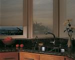 Kitchen at dusk -- Hunter Douglas Duette Window Shades/Blinds  in kitchen -- Highland Beach Oceanfront in Florida