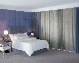 Blackout Fabric Vertical Blinds With Drapery In Bedroom with Upholstered Wall -- Palm Beach Gardens Florida