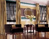 Hunter Douglas Woven Woods Roman Shades/Blinds In Conjunction With Drapery Panels on Metal Rod -- Lantana Florida Home