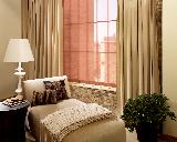 Solar Screen Roller Shade/Blind on window with drapery panels-- Singer Island/Riviera Beach Residence
