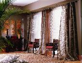 Puddled Drapery Panels and white wood blinds -- Boca Raton Florida