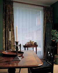 Lantana Florida -- Hunter Douglas Luminette shades/blinds framed by drapery panels for Sliding Glass Door
