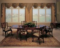 Gorgeous swag top treatment highlighted by functional Hunter Douglas Silhouette Shades overlooking golf course in Lake Worth Florida