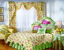 matching custom comforter bed skirt and drapery treatment with sheers make this very colorful and eye-catching bedroom in Boynton Beach Florida