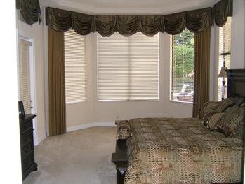 Swag Top Treatment with drapery panels and wooden window blinds -- Wellington Florida Residence